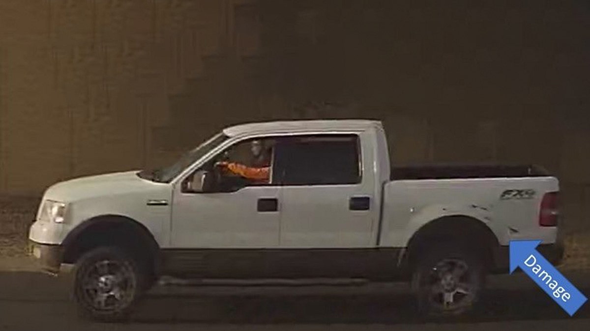 Image from surveillance video of a white pickup with damage that Phoenix police say was involved in a road-rage shooting Wednesday that left a 10-year-old girl dead.