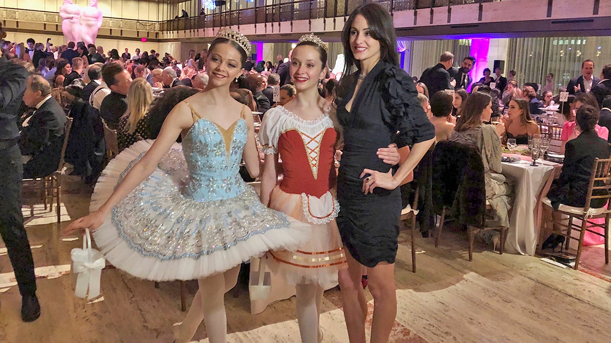 Choreographer Melanie Hamrick poses with dancers at the gala of Youth America Grand Prix, the world’s largest ballet scholarship competition, on Thursday, April 18, after the U.S. premiere of her new ballet, “Porte Rouge” (Red Door), based on classic Rolling Stones tunes arranged by her partner, Mick Jagger. The Stones frontman, recovering from medical treatment, watched from backstage and addressed the audience briefly via microphone before the show. (AP Photo/Jocelyn Noveck)