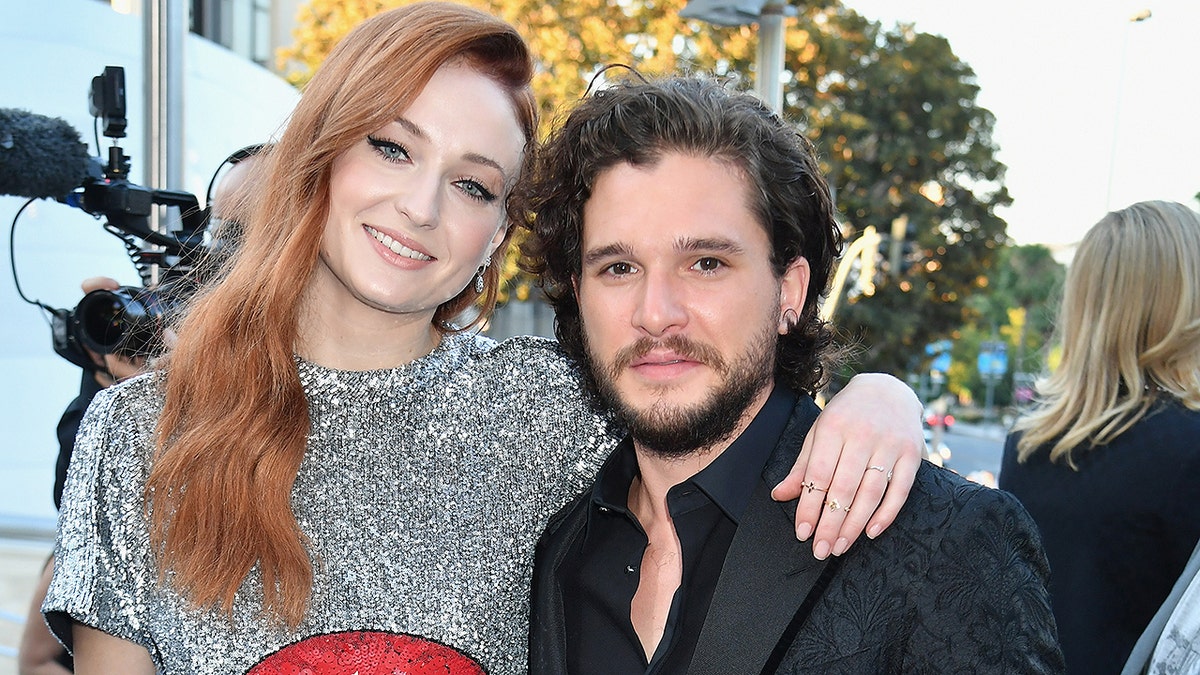 LOS ANGELES, CA - JULY 12: Actors Sophie Turner (L) and Kit Harrington at the Los Angeles Premiere for the seventh season of HBO's 