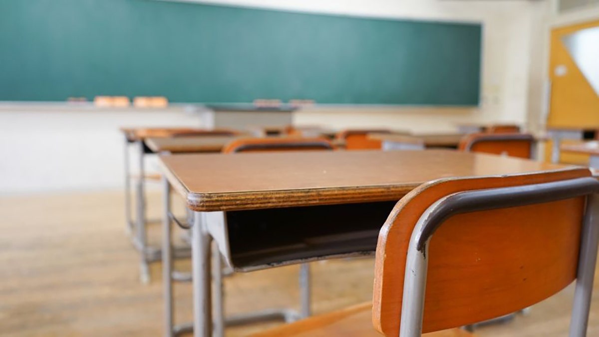 Desk in an empty classroom