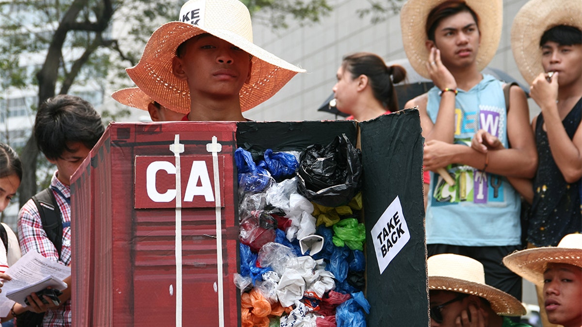 Environmental activists protesting the tons of garbage Canada shipped to the Philippines in front of the Canadian Embassy in Makati in 2015.<br data-cke-eol="1">