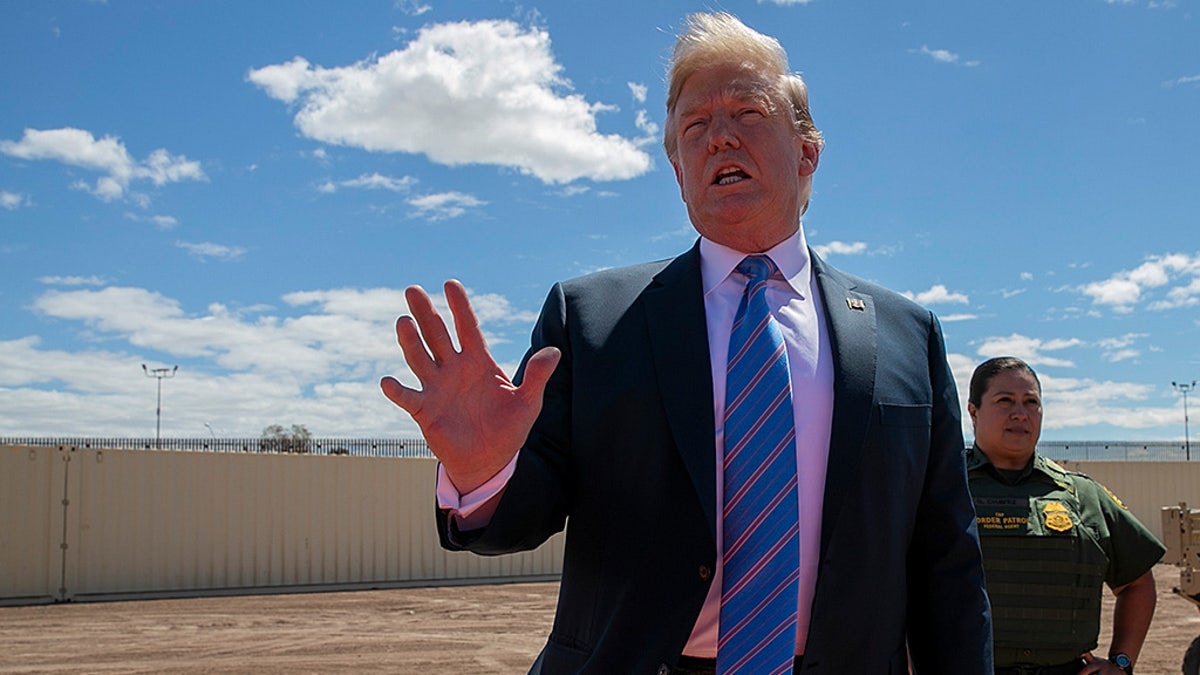 President Donald Trump speaks as he visits a new section of the border wall with Mexico in Calexico, Calif., Friday April 5, 2019. (AP Photo/Jacquelyn Martin)