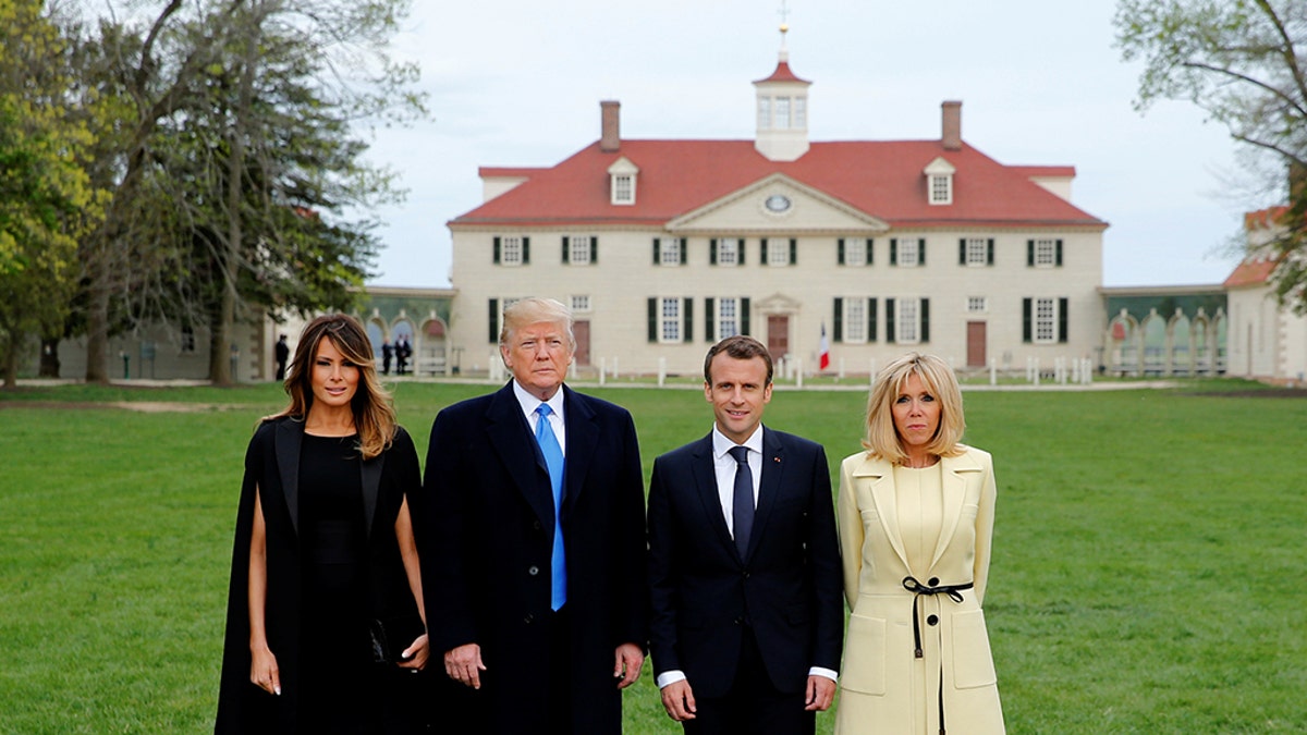 President Donald Trump and first lady Melania Trump and French President Emmanuel Macron and Brigitte Macron pose in front of Mount Vernon, on April 23, 2018. 