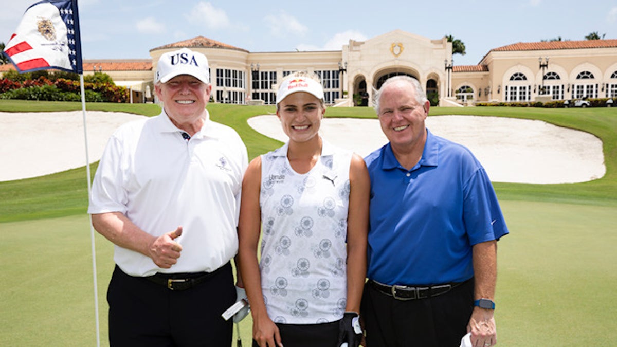 President Trump poses with professional golfer Lexi Thompson and radio host Rush Limbaugh on Friday, April 19, 2019.