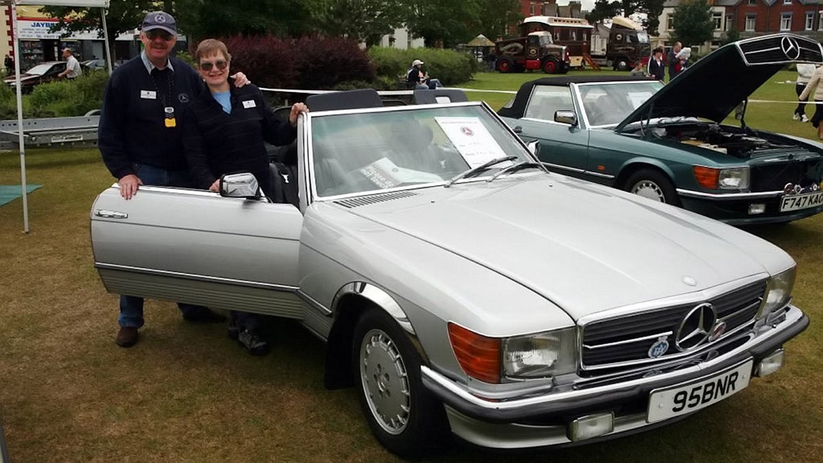 William Reid and Kathryn Workman were putting their Mercedes-Benz convertible away for the winter.