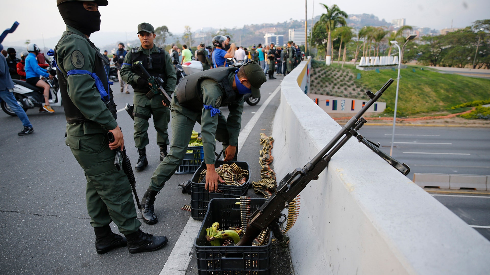 Soldiers take a position on an overpass next to La Carlota air base in Caracas, April 30, 2019. Venezuelan opposition leader Juan Guaido has called for a military uprising, in a video shot at the air base showing him surrounded by soldiers and accompanied by detained activist Leopoldo Lopez.