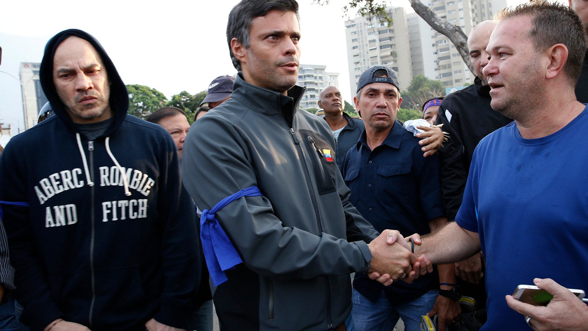 Opposition leader Leopoldo Lopez, is greeted by a supporter outside La Carlota air base in Caracas, April 30, 2019.