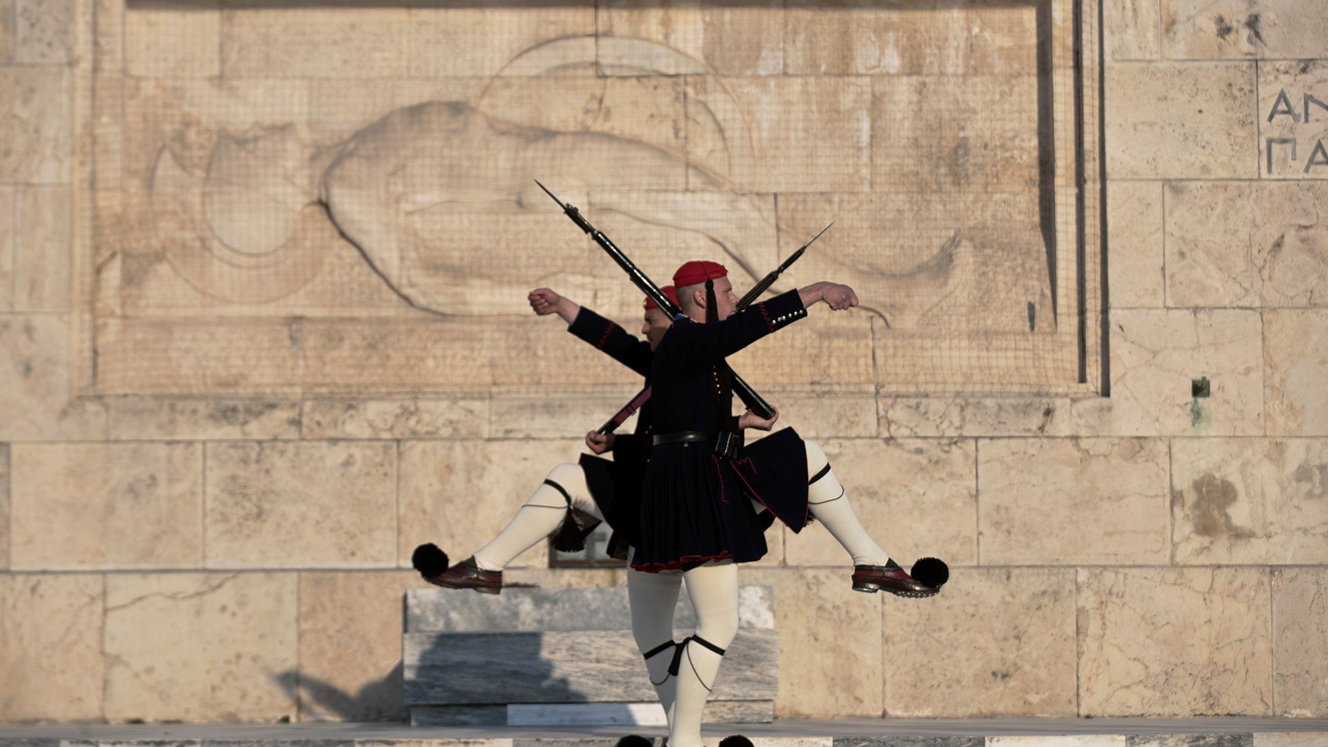 Greek Presidential guards take part in the changing of the guard ceremony, at the tomb of the unknown soldier in Athens, April 3, 2019.