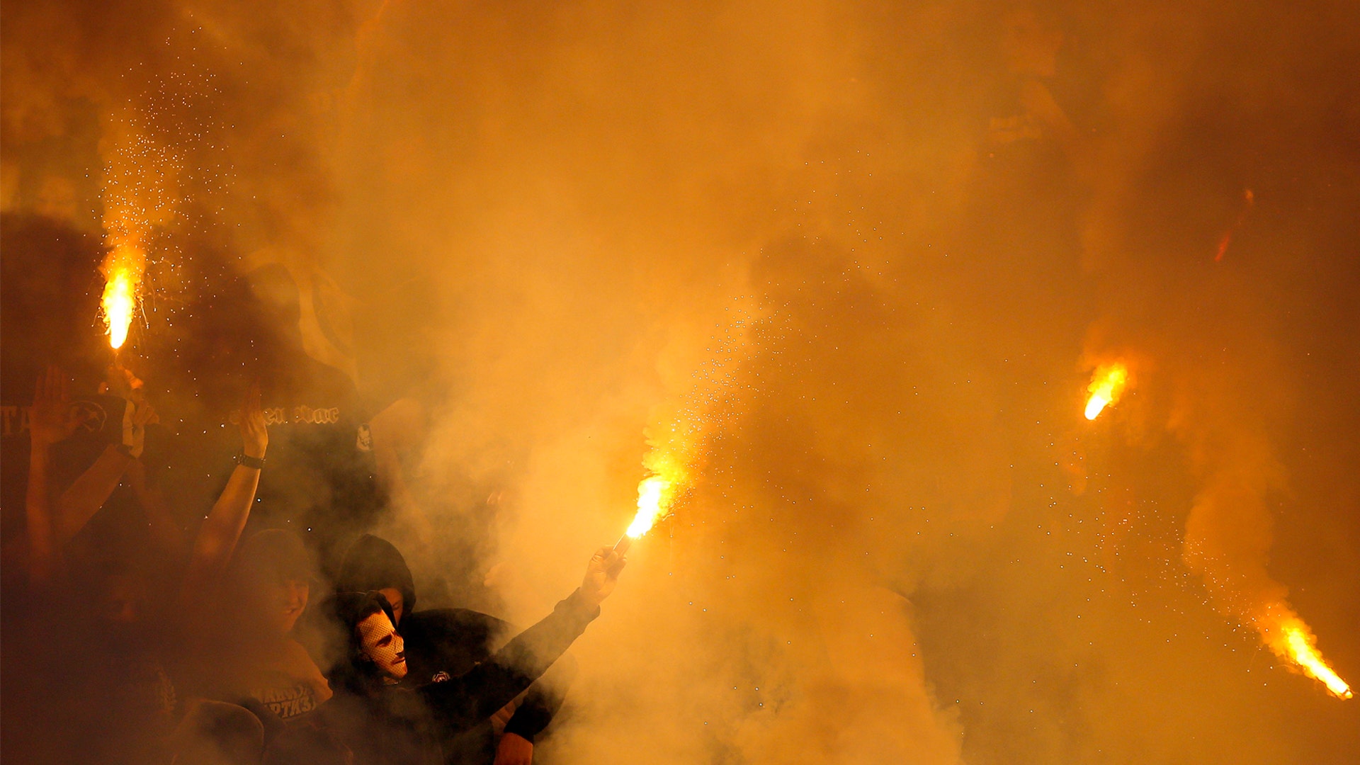 Soccer fans light torches during a Serbian National soccer league derby match between Red Star and Partizan in Belgrade, Serbia, April 25, 2019. 