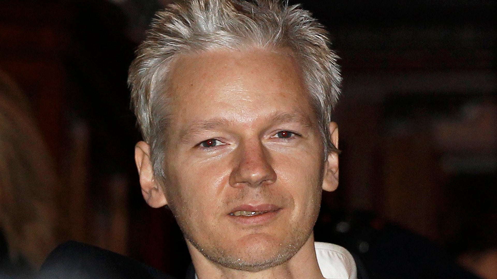 Assange outside the High Court in London, Dec. 16, 2010. 