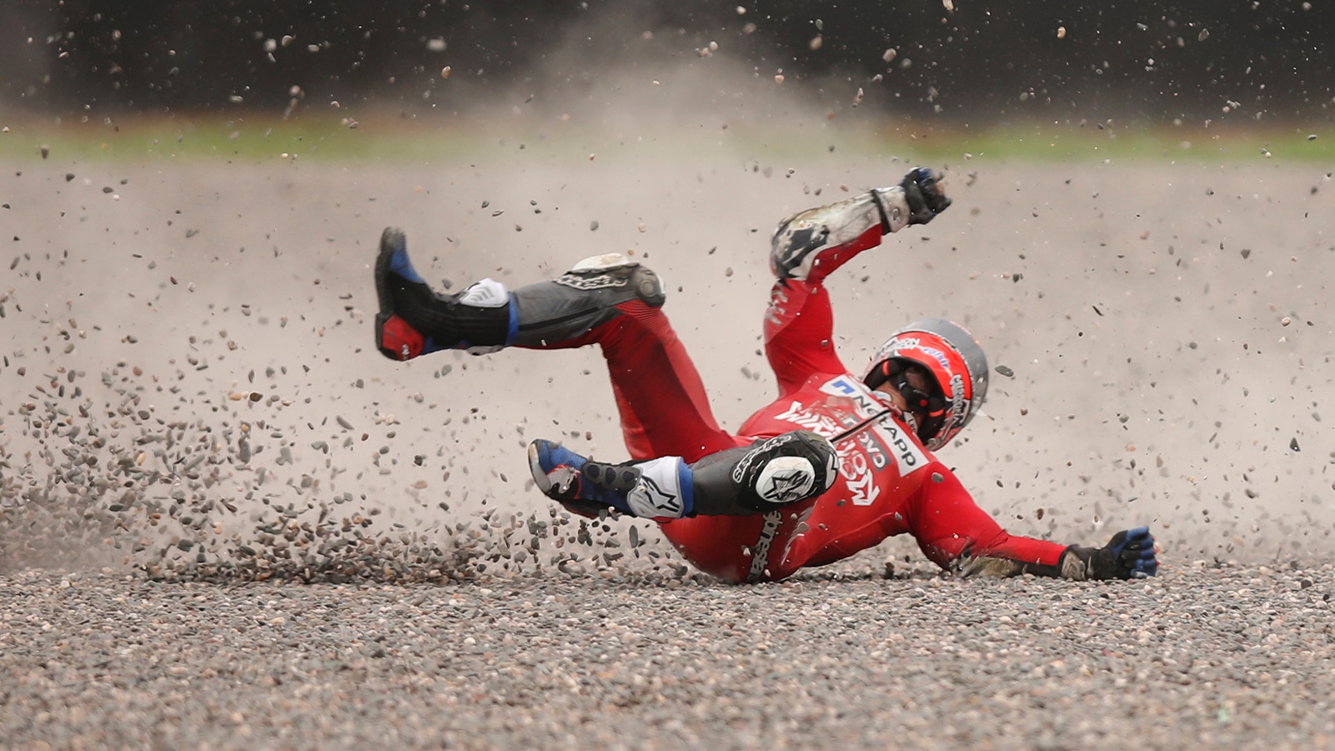Andrea Dovizioso of Italy falls from his bike during a Moto GP free practice run at the circuit in Termas de Rio Hondo, Argentina, March 30, 2019.