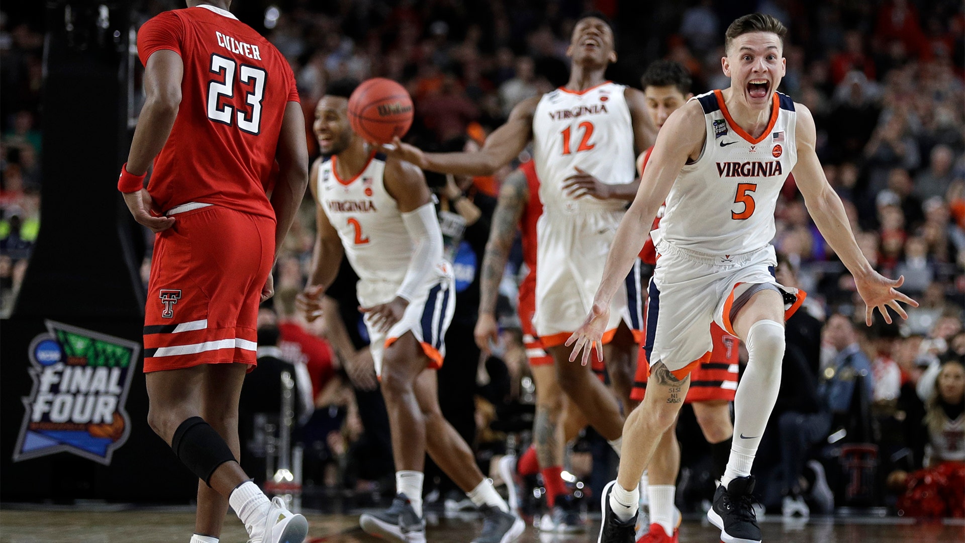 Virginia's Kyle Guy celebrates in front of Texas Tech players after winning the men's NCAA basketball championship in Minneapolis, April 8, 2019.