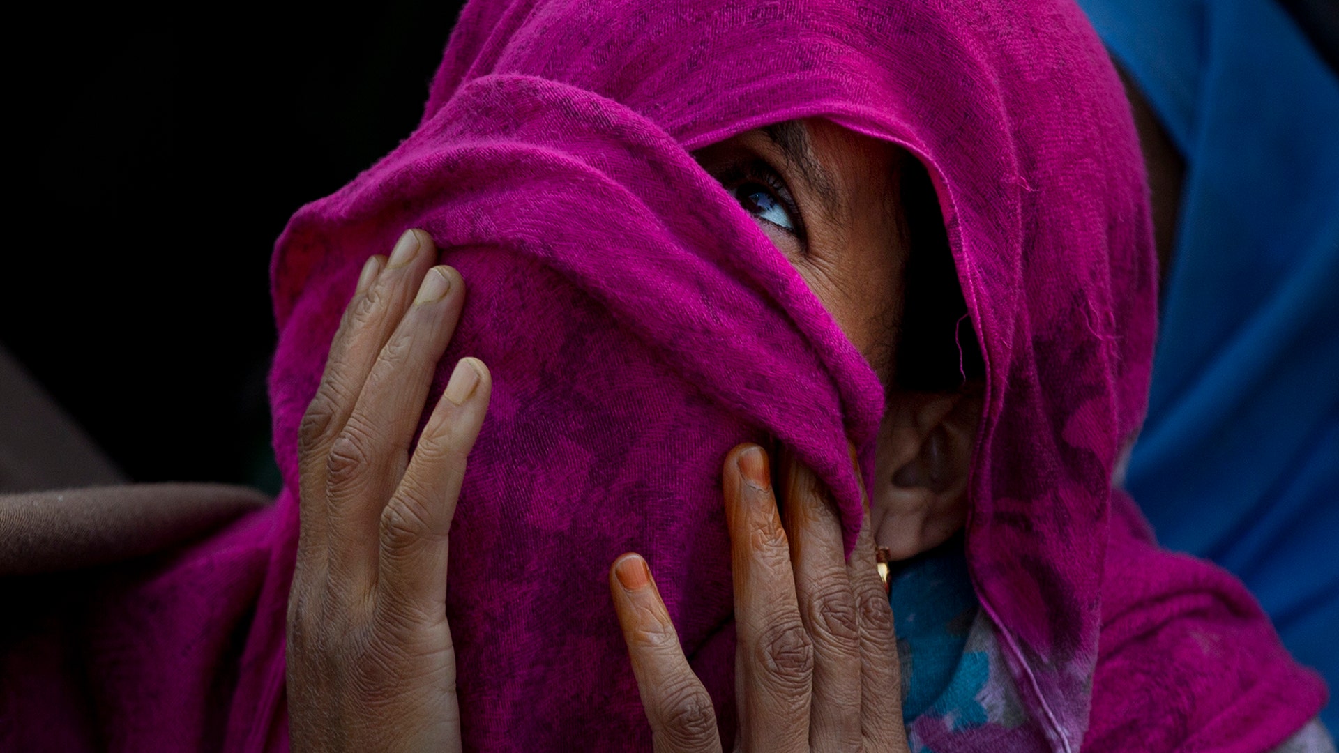 A Kashmiri Muslim woman with her face covered prays on the occasion of Mehraj-u-Alam, believed to mark the ascension of Prophet Muhammad to heaven, in Srinagar India, April 4, 2019. 