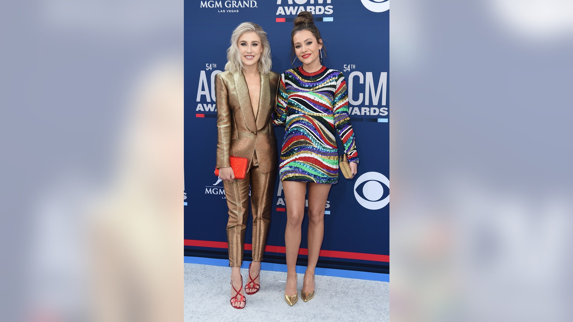 Maddie Marlow, in a gold pant suit, and Tae Dye, in a sequined mini, stun at the award show.