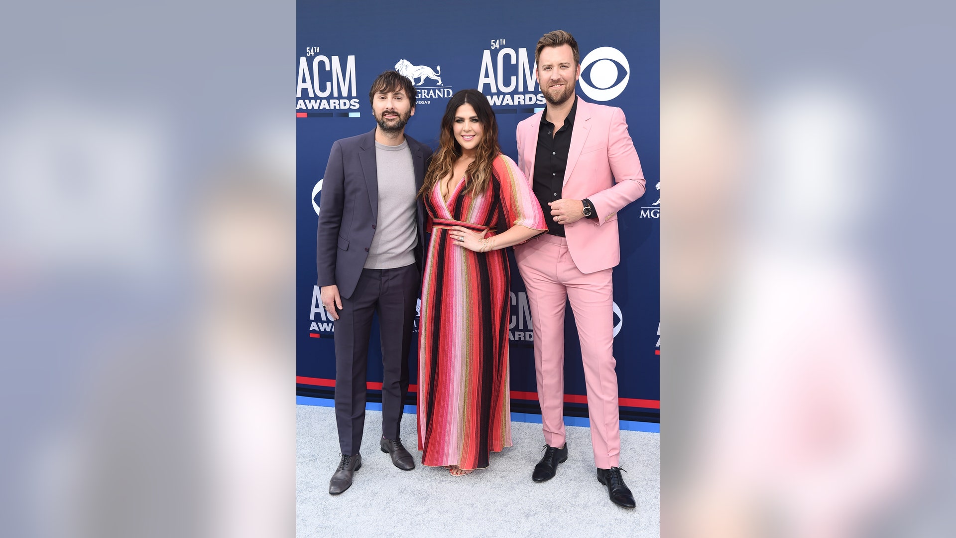 Dave Haywood, Hillary Scott and Charles Kelley of Lady Antebellum strike a pose on the 2019 ACMs red carpet.