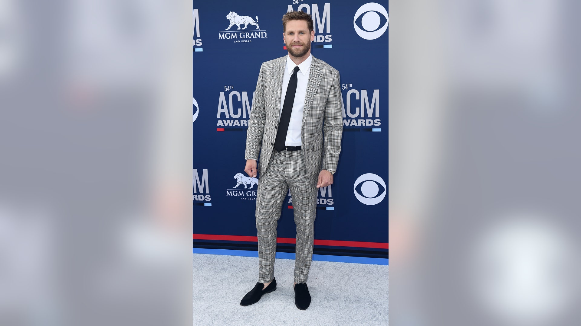 Chase Rice steps out in a plaid suit at the award show.