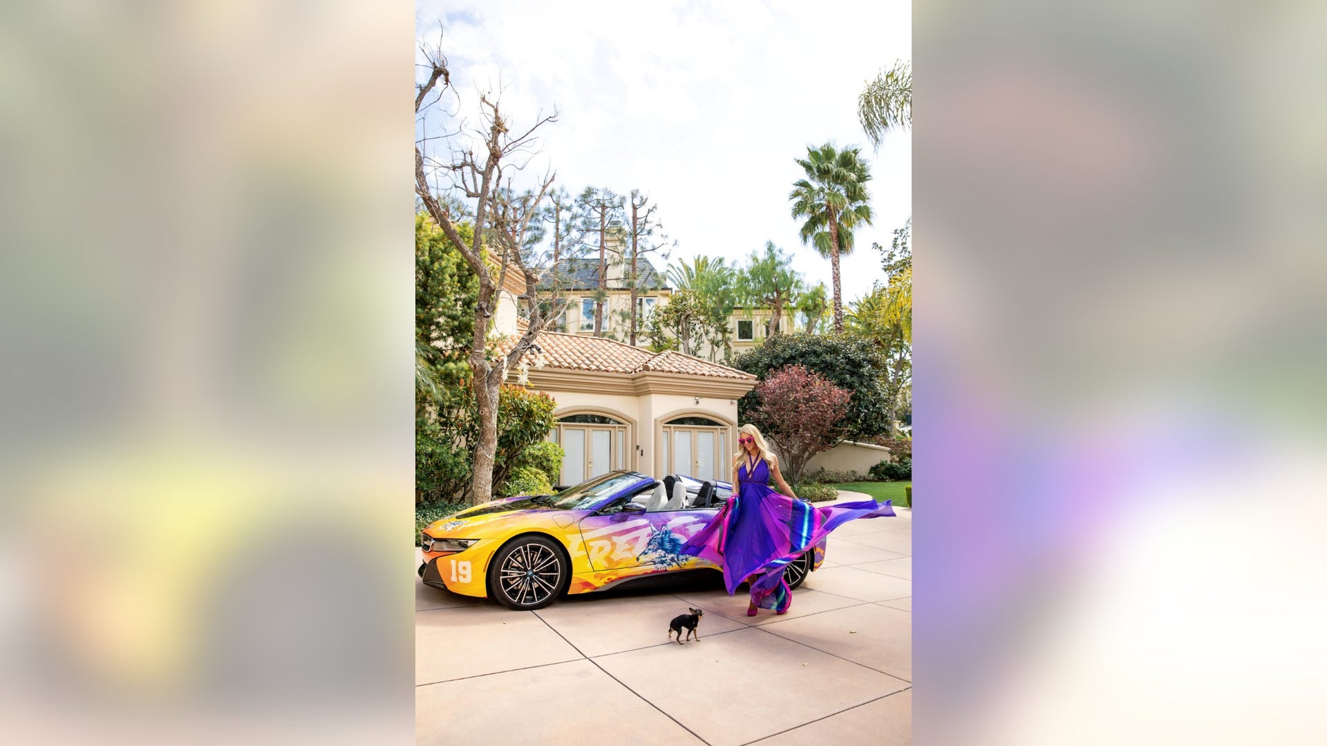 Paris Hilton showed off her fabulous figure as she color-coordinated with her custom wrapped BMW i8 ride to Week 1 of Coachella, produced by Mirrored Media in Palm Springs, Calif. in April 2019.