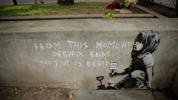 Possible Banksy artwork appears near London climate change protest