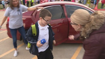 Texas boy, 7, with cancer gets police, fire escorts back to school