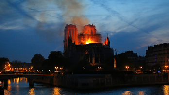 The Latest: French leader vows to rebuild damaged Notre Dame
