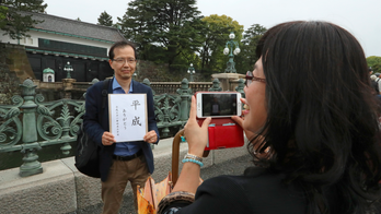 The Latest: Japanese people mark end of Heisei era