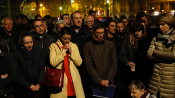 Prayers, hymns, community shared in firelight of Notre Dame