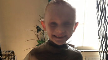 Body of missing five-year-old boy found in shallow grave, parents charged with murder