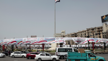 Posters backing Egypt president, charter changes flood Cairo