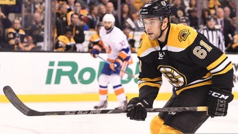 Ex-hockey player returns to ice more than 2 years after going into cardiac arrest before game, leg amputation