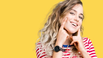 Forcing a smile at work linked to heavy drinking: study