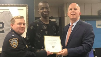 Domino's 'superhero' delivery man who chased down thief honored by NYPD