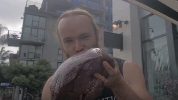 Anti-vegan protester eats decapitated squirrel at vegan market