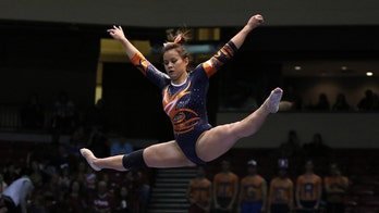 Auburn gymnast who broke both knees during routine walks down aisle for wedding