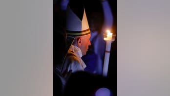 At Easter vigil, Pope Francis urges resistance to 'glitter of wealth'