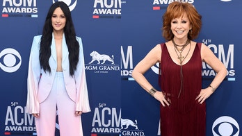 Kacey Musgraves slammed on social media for not standing for Reba McEntire's ACM awards performance
