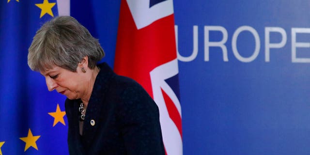 FILE: British Prime Minister Theresa May leaves after addressing a media conference at an EU summit in Brussels.