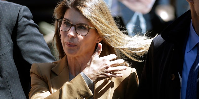 Actress Lori Loughlin arrives at federal court in Boston on Wednesday, April 3, 2019, to face charges in a nationwide college admissions bribery scandal.