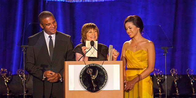 Geri Jewell (center) delivering a speech.
