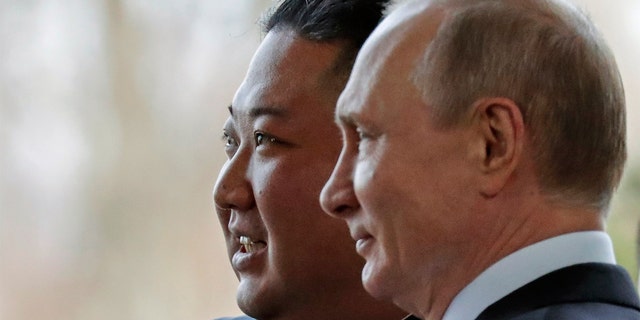 Russian President Vladimir Putin, right, and North Korea's leader Kim Jong Un pose for photographers during their meeting in Vladivostok, Russia, Thursday, April 25, 2019. (AP Photo/Alexander Zemlianichenko, Pool)