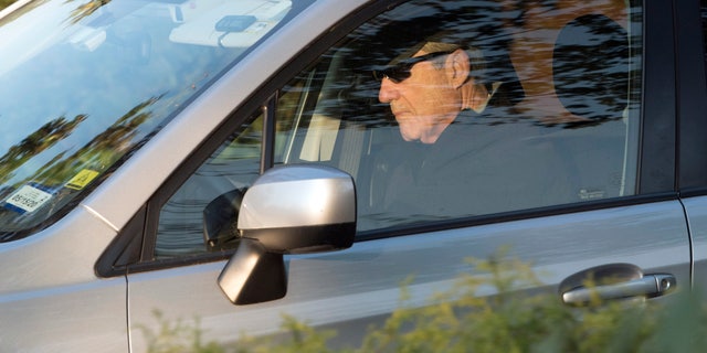 Special Counsel Robert Mueller drives away from his Washington home on Wednesday. Outstanding questions about the special counsel's Russia investigation have not stopped President Donald Trump and his allies from declaring victory. (AP Photo/Kevin Wolf)