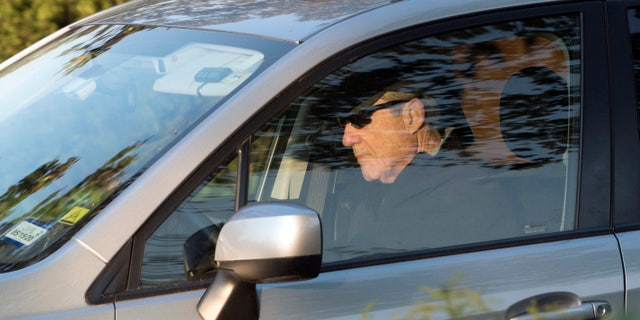 Special Counsel Robert Mueller drives away from his Washington home on Wednesday. Outstanding questions about the special counsel's Russia investigation have not stopped President Donald Trump and his allies from declaring victory. (AP Photo/Kevin Wolf)