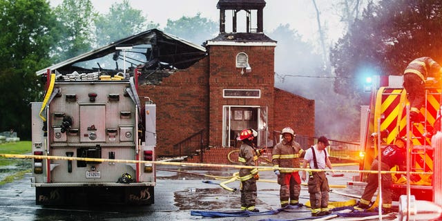 Firefighters and fire investigators respond to a fire at Mt. Pleasant Baptist Church Thursday, April 4, 2019, in Opelousas, La. Authorities in southern Louisiana are investigating a string of "suspicious" fires at three African American churches in recent days. Fire Marshal H. "Butch" Browning said it wasn't clear whether the fires in St. Landry Parish are connected and he declined to get into specifics of what the investigation had yielded so far but described the blazes as "suspicious."