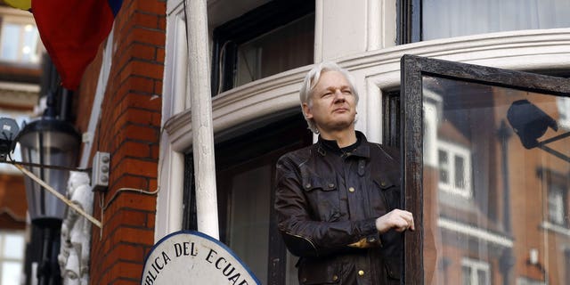 WikiLeaks founder Julian Assange greets supporters outside the Ecuadorian Embassy in London, May 19, 2017. (Associated Press)