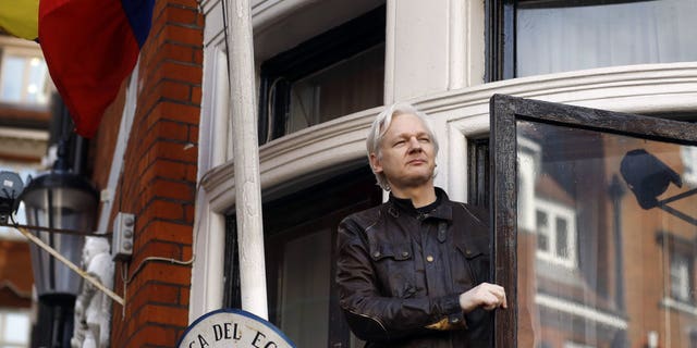 WikiLeaks founder Julian Assange greets supporters outside the Ecuadorian Embassy in London, May 19, 2017. (Associated Press)