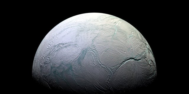 A view of Saturn's moon Enceladus taken by NASA's Cassini spacecraft. New models help explain why this moon ended up with a subsurface ocean while others nearby didn't.