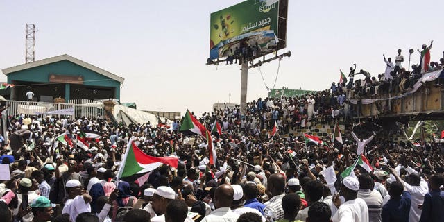 Demonstrators gather in Sudan's capital of Khartoum, Friday, April 12, 2019. The Sudanese protest movement has rejected the military's declaration that it has no ambitions to hold the reins of power for long after ousting the president of 30 years, Omar al-Bashir.