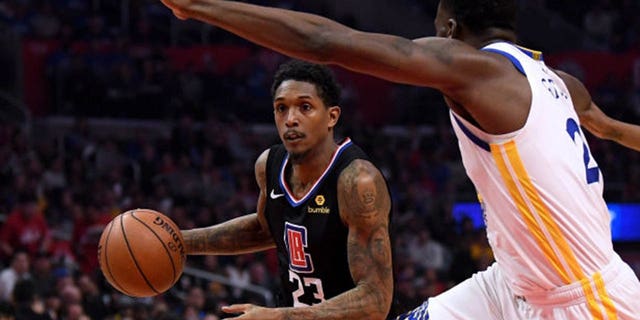 Lou Williams of the Los Angeles Clippers drives to the basket against Draymond Green of the Golden State Warriors during the 2019 NBA Playoffs at Staples Center in Los Angeles, April 21, 2019. (Getty Images)