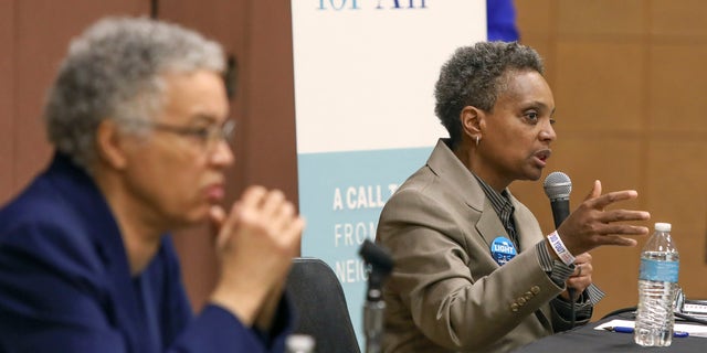 In this March 24, 2019 photo, Chicago mayoral candidate Lori Lightfoot, right, participates in a candidate forum in Chicago. Lightfoot and Toni Preckwinkle, left, are competing to make history by becoming the city's first black, female mayor. On issues their positions are similar. But their resumes are not, and that may make all the difference when voters pick a new mayor on Tuesday, April 2, 2019. (AP Photo/Teresa Crawford)