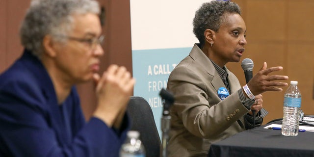 In this March 24, 2019 photo, Chicago mayoral candidate Lori Lightfoot, right, participates in a candidate forum in Chicago. Lightfoot and Toni Preckwinkle, left, are competing to make history by becoming the city's first black, female mayor. On issues their positions are similar. But their resumes are not, and that may make all the difference when voters pick a new mayor on Tuesday, April 2, 2019. (AP Photo/Teresa Crawford)