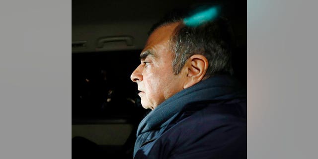 Former Nissan Chairman Carlos Ghosn in a car leaves his lawyer's office in Tokyo. 